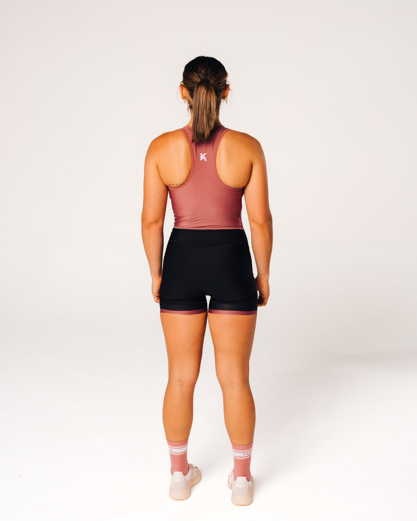 TUCK Women’s Signature Unisuit - Pink